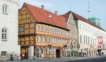 Bicyclists In Front Of The Jørgen Olufsens House Stock Photo